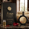 A luxurious product display of Mirsaal Valentine Eau de Parfum, featuring the black wax-sealed 100ml bottle next to its matching black gift box, styled with a rose petal and golden accents on a classic table setting.