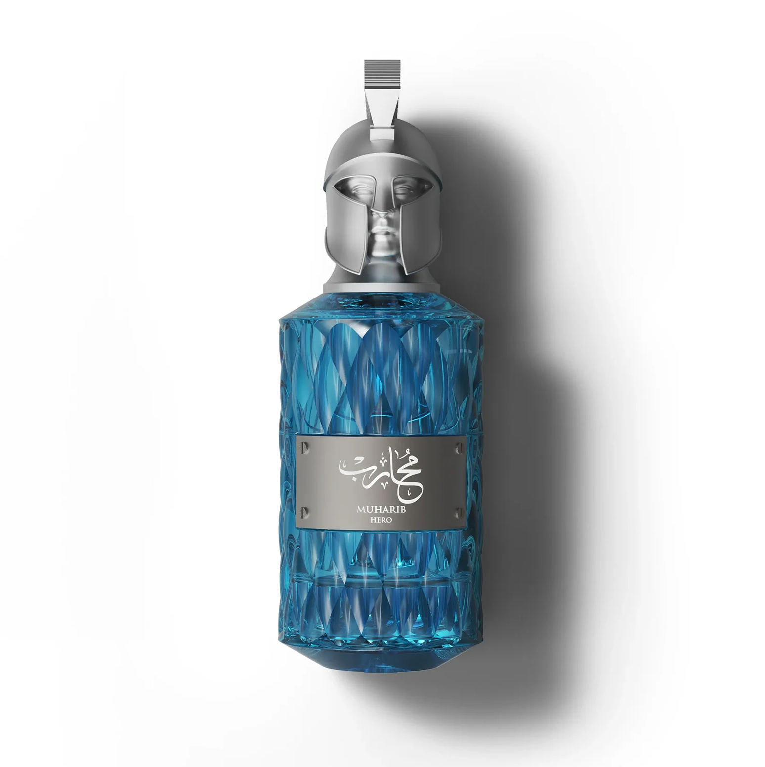 Le Falconé Muharib Hero 85ml men's perfume bottle with a silver Spartan helmet cap. A detailed studio shot of the blue glass Le Falconé Muharib Hero 85ml bottle, highlighting its unique, sculptural silver Spartan helmet cap and the textured, crystalline design of the bottle.